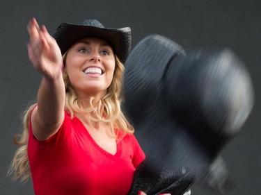 Kira Isabellahad volunteers throw cowboy hats to the crowd as day 2 of the RBC Ottawa Bluesfest continues at the Canadian War Museum.