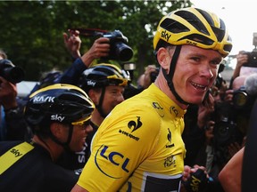 PARIS, FRANCE - JULY 26:  Chris Froome of Great Britain and Team Sky is surrounded by the media after his overall win following the twenty first stage of the 2015 Tour de France, a 109.5 km stage between Sevres and Paris Champs-Elysees, on July 26, 2015 in Paris, France.