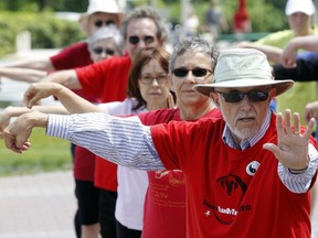 Leo Makela, right, practices with fellow Taoist Tai Chi practioners in Marion Dewar Plaza Wednesday July 08, 2015. The group is there every Wednesday throughout July and August.