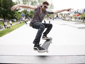 Local skateboarder Adam Scarabelli shows off some tricks at the official re-opening of McNabb Park and Charlie Bowins skate park on Saturday
