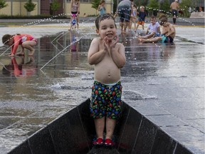 Lucas Gemmell, 3, was among the first to try out Lansdowne Park's new water plaza Friday.