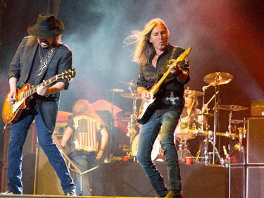 Lynyrd Skynyrd including Gary Rossington (L) and guitarist Mark Matejka (R) on the Bell Stage as RBC Ottawa Bluesfest continues on Tuesday evening. Assignment - 121068 Photo taken at 21:40 on July 14. (Wayne Cuddington / Ottawa Citizen)