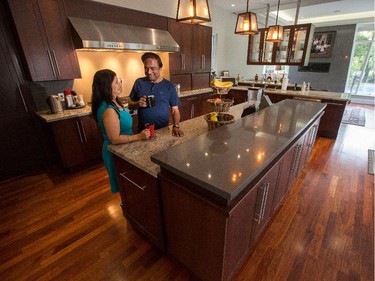 Madhu and Cuckoo Kochar hang out in the kitchen, where renovations included refacing the cabinets.