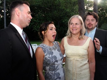 Mary Zborowski, manager of the Opera Lyra Chorus, gets a birthday serenade on Wednesday, July 8, 2015, from opera-singing stars Sean Clark, left, Sasha Djihanian, Benjamin Covey at the 20th Annual Garden Party held in Gatineau at the official residence of the Italian ambassador.