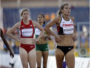 Canada's Melissa Bishop, right, looks up after competing in the semifinals of the women's 800 meter run during the Pan Am Games in Toronto on  Tuesday.