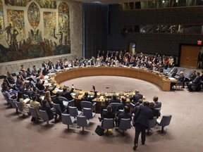 Members of the Security Council vote at United Nations headquarters, Monday, July 20, 2015. The U.N. Security Council unanimously endorsed the landmark nuclear deal between Iran and six world powers and adopted a series of measures leading to the end of U.N. sanctions that have hurt the Iranian economy.