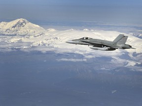 A CF-18 Hornet from 409 Tactical Fighter Squadron in Cold Lake, Alberta flies in the Alaskan airspace during a 2013 exercise. DND photo