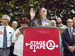 Ottawa Mayor Jim Watson speaks during a press conference on July 9 to announce the city's request to federal and provincial governments for funding for the next stage of light rail.