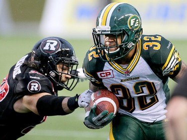 Ottawa player Jordan Verdone, left, grabs Kendial Lawrence.