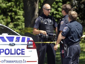 Ottawa Police investigate the scene of a homocide on Anna Ave between Admiral and General Ave where a woman was stabbed to death on Tuesday.