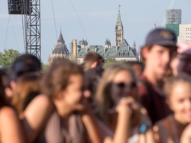 Parliament Hill looms in the distance as day 3 of the RBC Ottawa Bluesfest continues.