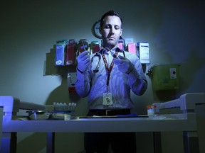 Patrick O'Byrne, a public health nurse and associate professor at University of Ottawa, gets a blood test ready at the Ottawa Public Health Sexual Clinic, where they've seen a  spike in syphilis.