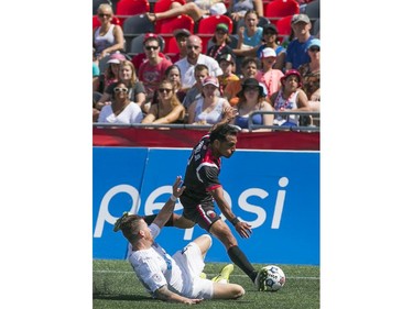 Paulo Junior (R) of the Ottawa Fury FC vies for the ball with Carolina RailHawks Wes Knight (L) during the teams NASL game at TD Place in Ottawa, July 26, 2015.
