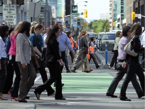 Pedestrians cross Laurier Avenue  in Ottawa in 2014.