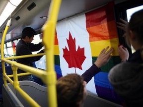 People celebrate Capital Pride Week during a pancake breakfast at Ottawa Police Headquarters in Ottawa in partnership with the Ottawa Police Service Liaison Committee for the Gay, Lesbian, Bisexual, and Trans (GLBT) Communities. (Cole Burston/Ottawa Citizen)