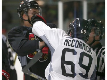Prospects Andreas Englund #39 gets shoved in the face by Max McCormick #69 of the Ottawa Senators during a scrimmage at the Kanata Recreation Centre in Ottawa on July 2, 2015.