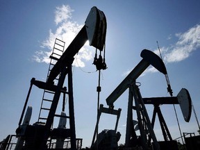 Pumpjacks at work pumping crude oil near Halkirk, Alta., June 20, 2007.