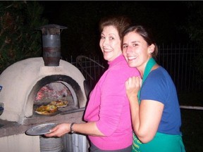 Queta Villegas and Kathy Murillo anxiously wait for their pizzas to be ready.
