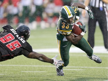 Shakir Bell, right, avoids a grab by Moton Hopkins.