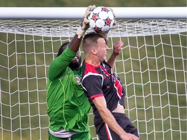 Silverbacks goal keeper Steward Ceus, left, battles Oliver Minatel during a corner kick attempt by Ottawa.