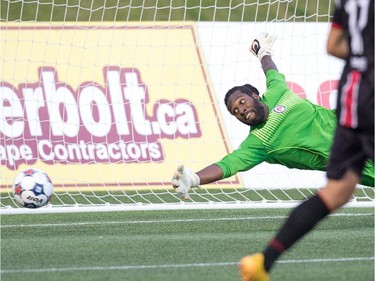 Silverbacks goal keeper Steward Ceus makes a gall saving block.