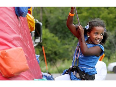 Six-year-old Shaima Sirag had a hoot climbing her way to the top of the inflatable rock-climbing wall outside the EY centre where celebrations were held for the end of Ramadan..