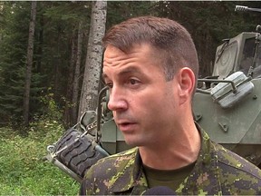 In this screengrab from video, Lt.-Col. Mason Stalker is interviewed as Canadian troops fight fires in Montreal Lake, Sask., in early July. He faces serious, sex-related charges.