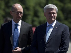 Canadian Prime Minister Stephen Harper and Ukraine Prime Minister Arseniy Yatsenyuk are seen during a visit to the Academic Institute of the National Academy of Internal Affairs of Ukraine for Training of Specialists for Public Safety, Psychological Service and National Guard of Ukraine Units in Kyiv, Ukraine on Saturday, June 6, 2015.