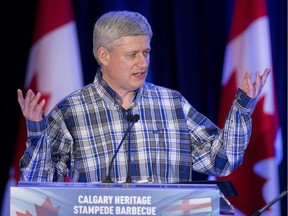 Prime Minister Stephen Harper speaks at the annual South West Stampede barbecue in Calgary on Saturday, July 4, 2015.