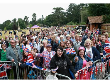 Members of the public queue up outside the Sandringham Estate and the Church of St Mary Magdalene as they wait for the Christening of Princess Charlotte of Cambridge on July 5, 2015 in King's Lynn, England.
