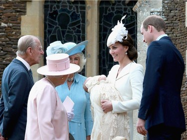 Catherine, Duchess of Cambridge, Prince William, Duke of Cambridge, Princess Charlotte of Cambridge and Prince George of Cambridge talk to Queen Elizabeth II, Prince Phillip, Duke of Cambridge and Camilla, Duchess of Cornwall at the Church of St Mary Magdalene on the Sandringham Estate after the Christening of Princess Charlotte of Cambridge on July 5, 2015 in King's Lynn, England.