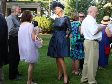 The Earlene's House of the Fashion show saw volunteers models, such as Manja Mackley, roam through the crowd and mingle during the 20th Annual Garden Party for Opera Lyra Ottawa, held Wednesday, July 8, 2015, at the official residence of the Italian ambassador.