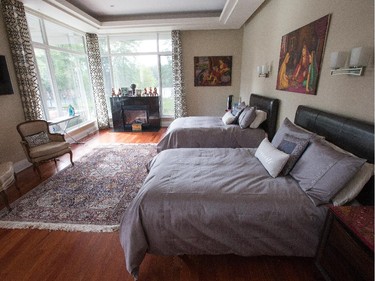 The sprawling bungalow is now 10,000 square feet. Shown is the master bedroom.