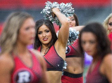 The Redblacks Cheer Team is out early to practice.