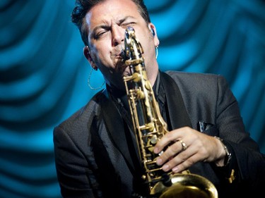 The saxophone player with Johnny Reid performed on the Bell Stage Sunday July 19, 2015, the last night of RBC Ottawa Bluesfest .