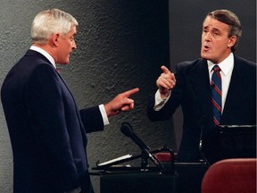 Liberal leader John Turner (left) and Conservative leader Brian Mulroney point fingers at each other during a debate from the 1988 federal election campaign which was moederated by David Johnston.