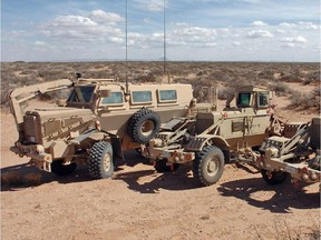 Canada's Department of National Defence said it tried to sell some surplus Buffalo, left, and Husky vehicles, but could not find any buyers.