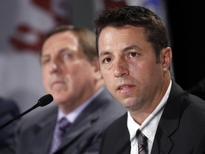 University of Ottawa Gee-Gees alumnus and former Ottawa Senators coach Jacques Martin, left, helped select Patrick Grandmaître as the new head coach of the school's Gee-Gees men's hockey team. The appointment was announced Wednesday.
