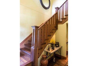 Like the floors, the custom-designed staircase is made of quartersawn American walnut in keeping with the home’s American southwest theme, says Henry, adding that the newel post gives “a little bulkiness” to the staircase.