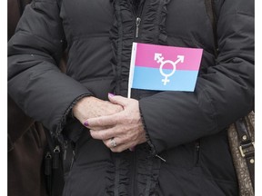 A photo taken when members and supporters of the transgender community  took part in a flag raising ceremony in Ottawa in November, 2013. Jenna Tenn-Yuk writes that trans teens should have access to universal bathrooms in school.