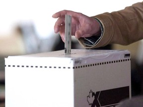 A man casts his vote for the 2011 federal election in Toronto in this May 2, 2011 photo.