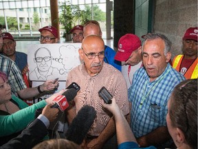 Abed Madi, the president of the airport unit of Unifor Local 1688, speaks to the media after he led his locked out members into City Hall on Tuesday to demand a meeting with Mayor Jim Watson. The union met with Watson on Wednesday.