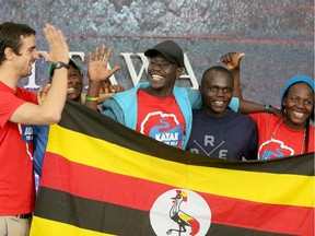 After Canadian immigration officials finally granted visas to four members of the Ugandan freestyle kayaking team, they happily arrived at the Ottawa airport Monday to their waiting coach, Sam Ward (far left). The kayak team includes, from left, David Egesa, Sadat Kawawa, Yusuf Basalirwa and Amina Tayona.