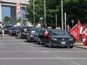 Airport Taxi drivers demonstrate on Airport Parkway Private on Aug. 13.