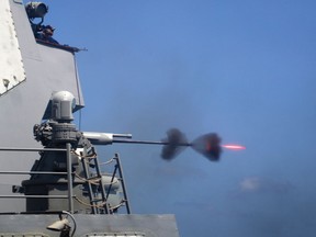 110228-N-5838W-004
GULF OF ADEN (Feb. 28, 2011) An MK-38 25mm gun system is fired during a live-fire exercise aboard the guided-missile destroyer USS Mason (DDG 87). Mason is deployed as part of the Enterprise Carrier Strike Group and assigned to Combined Task Force 151, supporting maritime security operations and theater security cooperation efforts in the U.S. 5th Fleet area of responsibility. (U.S. Navy photo by Mass Communication Specialist 3rd Class Jeffry A. Willadsen/Released)