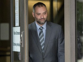 Benjamin Perrin, former legal adviser for the Prime Minister's Office, leaves the courthouse in Ottawa following his second day of testimony at the trial of former Conservative Senator Mike Duffy on Friday.