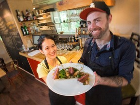 Chef and co/owners of Tante Carole restaurant in Chelsea Quebec, Jonathan Harris and Suyeon Myeong with their pan-seared duck breast main course.