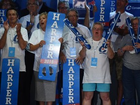 Conservative supporters cheer as Conservative leader Stephen Harper makes a campaign stop in Trois Rivier, Quebec, on Monday, August 24, 2015.