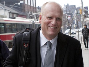 Human rights advocate Richard Warman approaches the Federal Court of Canada in Toronto on Tuesday, Dec. 13, 2011.