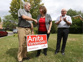 David Daubney (L) , the former Progressive Conservative MP for Ottawa West-Nepean, is supporting the Liberal candidate, Anita Vandenbeld (M) in this election local candidates from the Liberal Party of Canada were welcomed to Ottawa City Hall for a briefing on City of Ottawa priorities August 20, 2015. Moe Royer (R), co-chair to Vandenbeld's campaign looks on. (Jean Levac/ Ottawa Citizen)